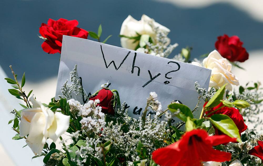 Flowers at the scene of the shooting in Sousse, Tunisia. The morning after a lone gunman killed tens of people at a beach resort in Tunisia, busloads of tourists are heading to the nearby Enfidha-Hammamet airport hoping to return to their home countries.