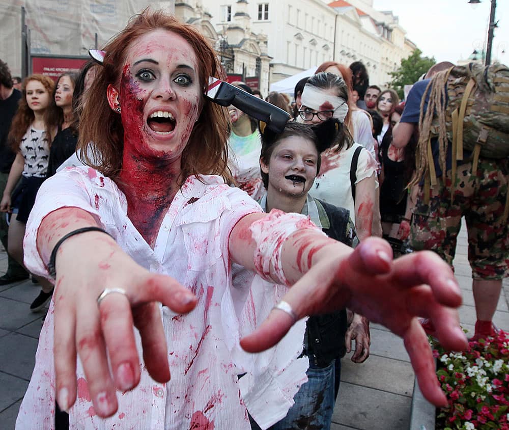 Young people dressed as zombies gather to take part in a Zombie Walk on streets of Warsaw, Poland.