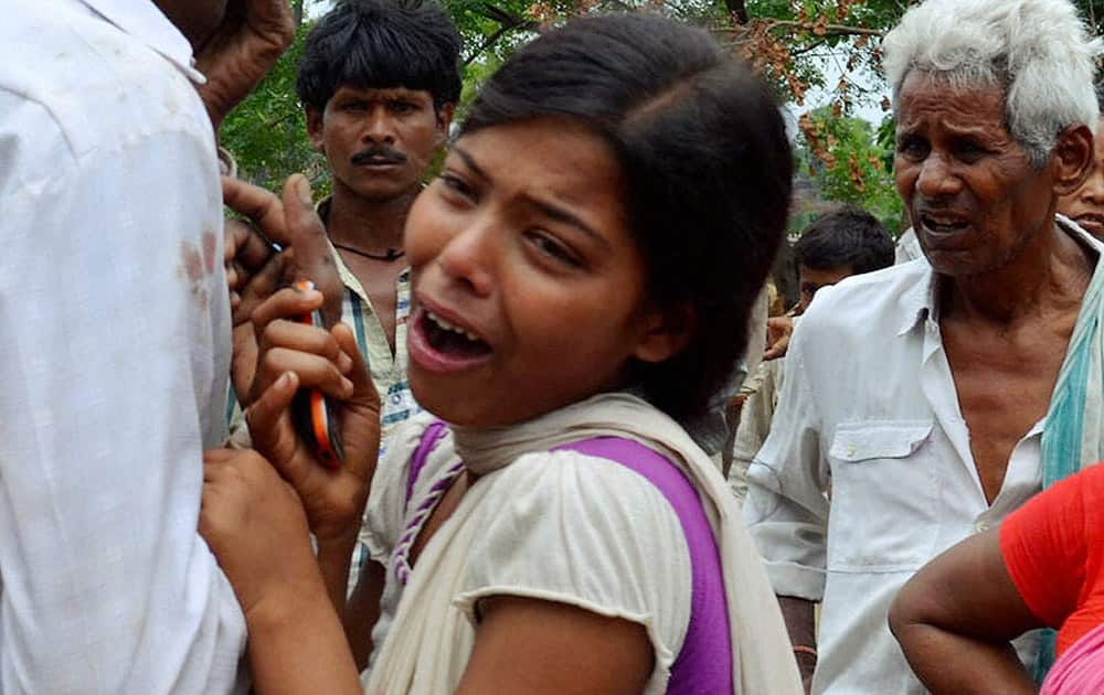 Wailing family members after two students of a residential public school were found dead, in Nirpur village at Nalanda district.