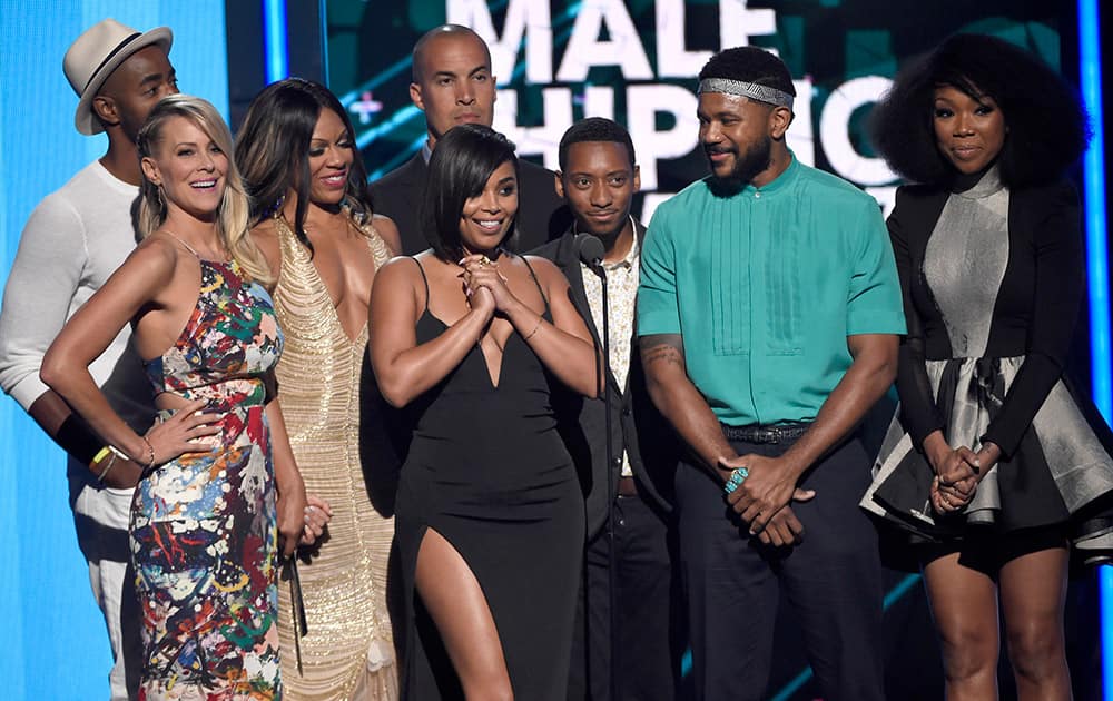 Jay Ellis, from left, Brittany Daniel, Wendy Raquel Robinson, Coby Bell, Lauren London, Barry Floyd, Hosea Chanchez, and Brandy Norwood present the award for best male hip hop artist at the BET Awards at the Microsoft Theater, in Los Angeles.