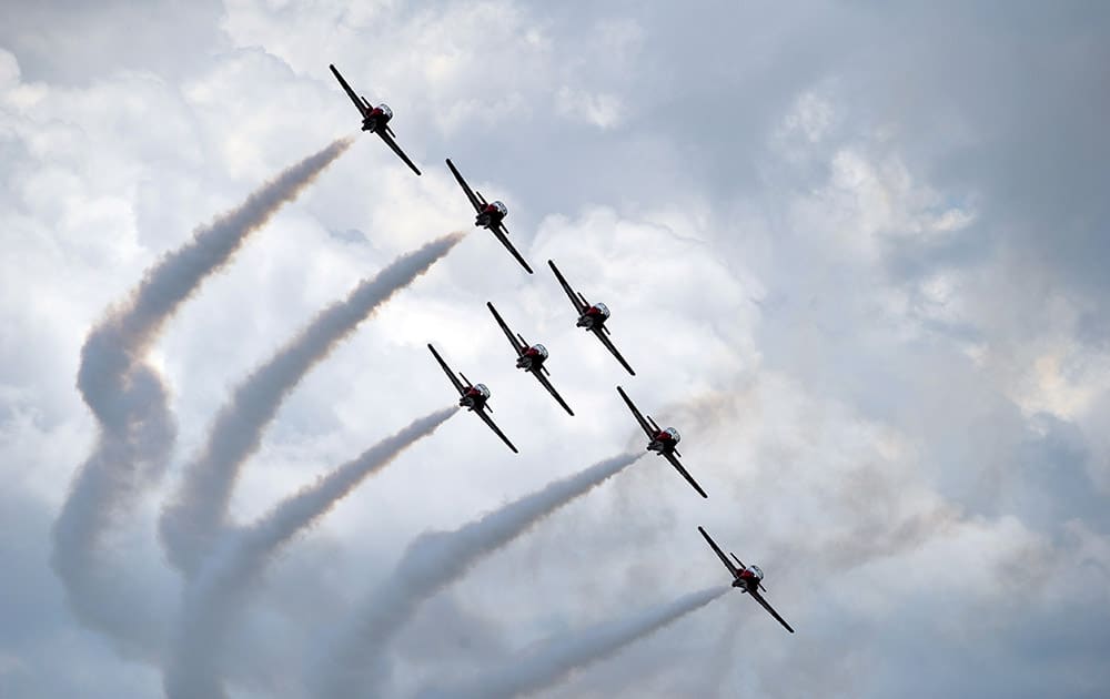 The Canadian Forces Snowbirds demonstration team flies in formation over the Ohio River during the ShrinersFest air show, in Evansville, Ind.