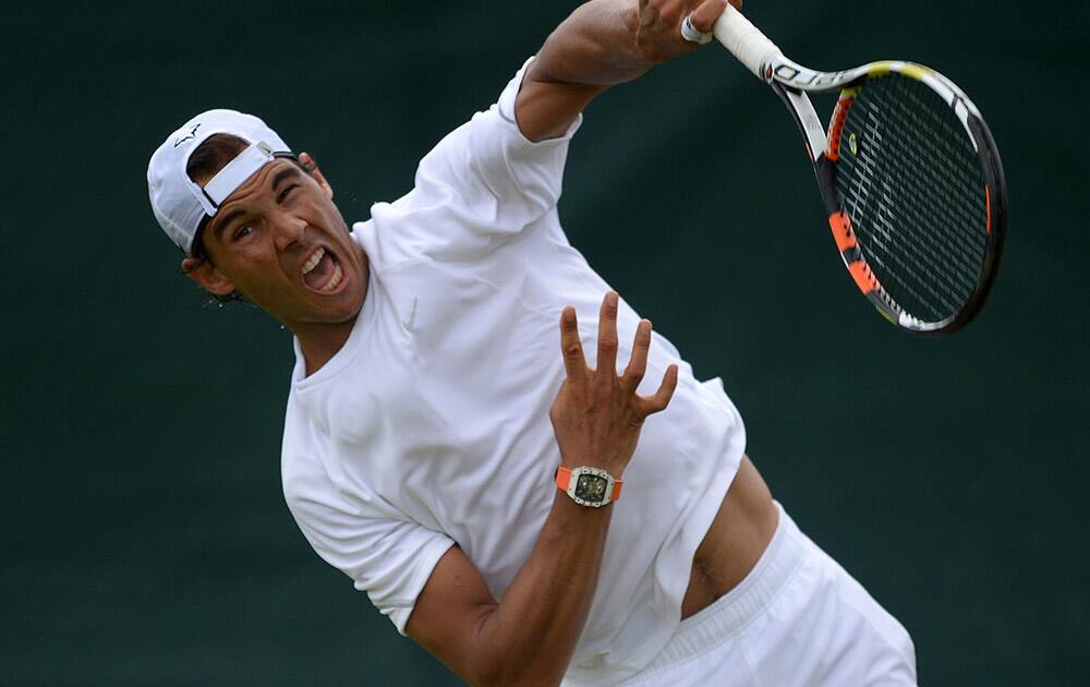 Spain's Rafael Nadal practices during a preview day for the Wimbledon Championships at the All England Lawn Tennis and Croquet Club, Wimbledon in London.