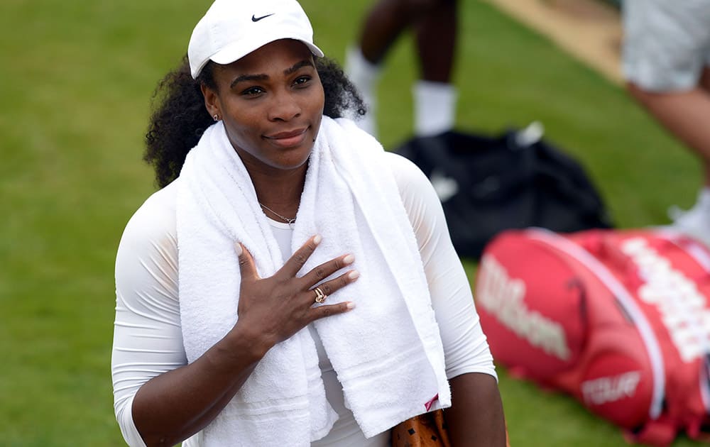 Serena Williams arrives for a practice at the Wimbledon Championships at the All England Lawn Tennis and Croquet Club, in Wimbledon London.