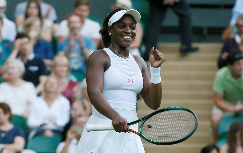 Sloane Stephens of the United States celebrates defeating Barbora Strycova of the Czech Republic during the women's singles first round match at the All England Lawn Tennis Championships in Wimbledon, London.