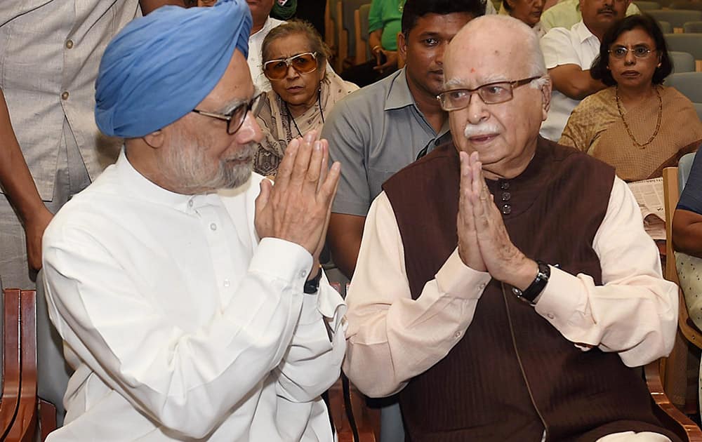 Former Prime Minister Manmohan Singh with BJP Leader L K Advani during the Memorial meeting of former bureaucrat M N Buch in New Delhi.