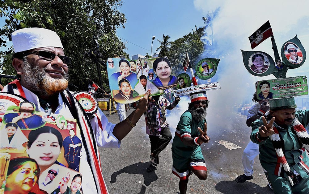 AIADMK supporters celebrate the party supremo and Tamil Nadu Chief Minister J Jayalalithaas victory in RK Nagar bypolls, at Poes Garden Residence in Chennai.