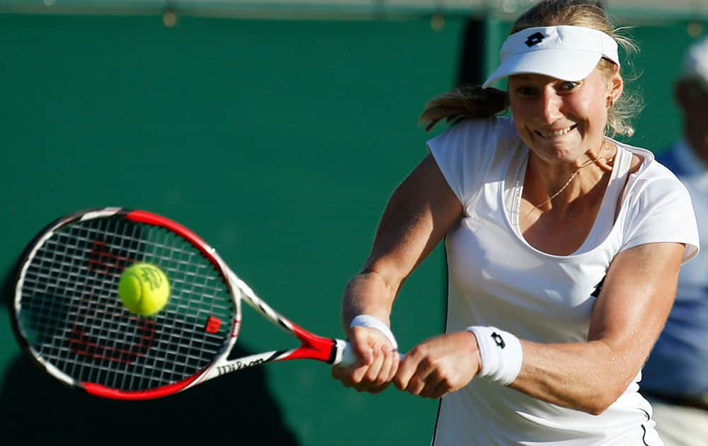 Ekaterina Makarova of Russia returns to Sachia Vickery of the United States during their women's singles first round match at the All England Lawn Tennis Championships in Wimbledon, London.