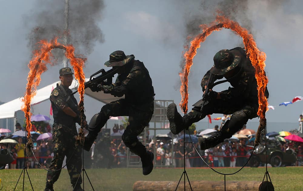 Chinese People's Liberation Army (PLA) personnel demonstrate during the open day of Stonecutter Island Navy Base in Hong Kong to mark the 18th anniversary of the Hong Kong handover to China in Hong Kong.