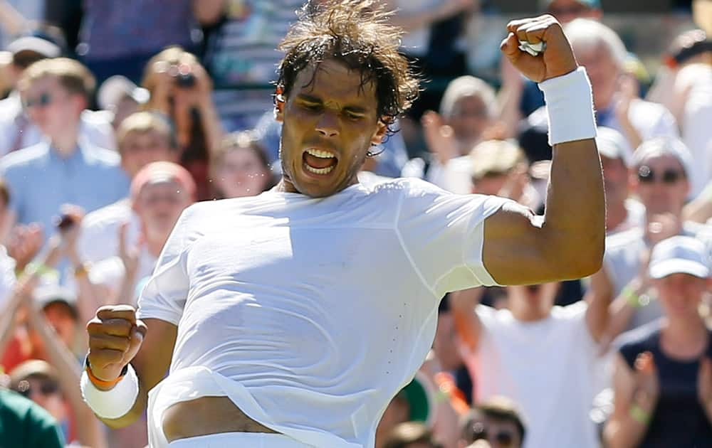 Rafael Nadal of Spain celebrates after defeating Thomaz Bellucci of Brazil in the singles first round match at the All England Lawn Tennis Championships in Wimbledon, London. Nadal won the match 6-4, 6-2, 6-4.