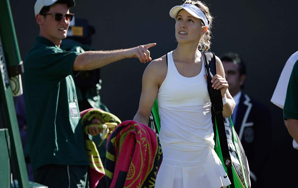 Eugenie Bouchard of Canada leaves the court after losing to Ying-Ying Duan of China in the singles first round match at the All England Lawn Tennis Championships in Wimbledon, London.