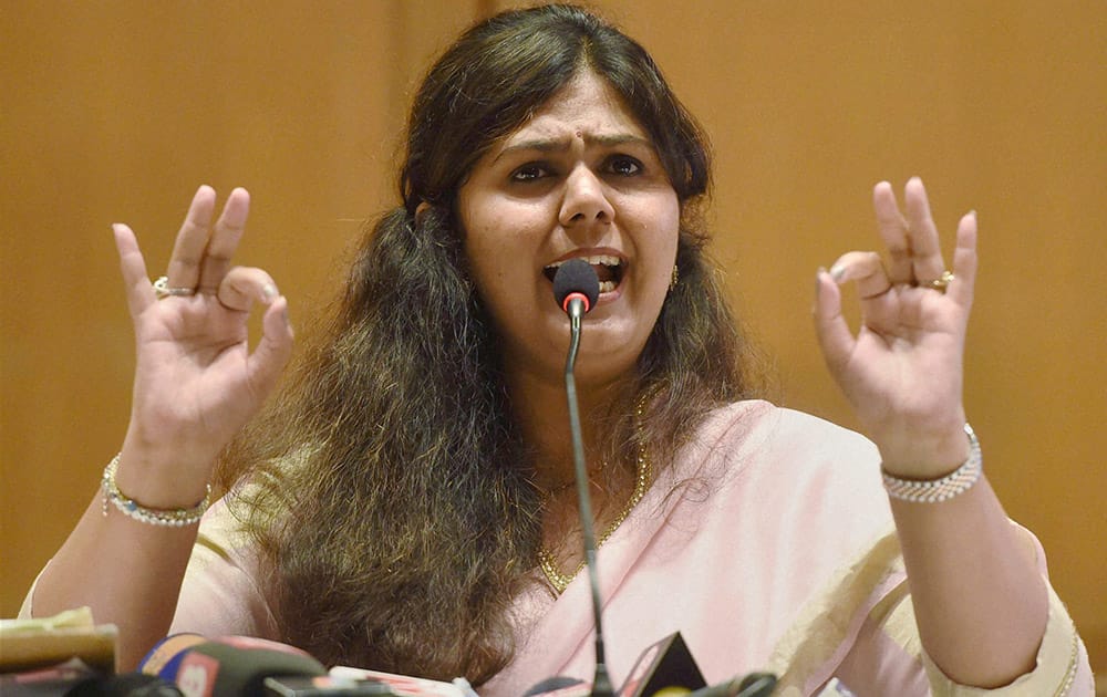 Maharashtra Women and Child Development Minister Pankaja Munde addresses a press meet to clarify her stand on the charges of corruption in Mumbai.