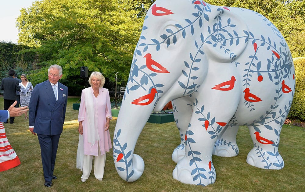 Prince Charles and wife Camilla at a garden auction of a life-size model elephant Tara to raise funds to save the Asian elephant from extinction, at Lancaster House, Cleveland Row, St Jamess, London.