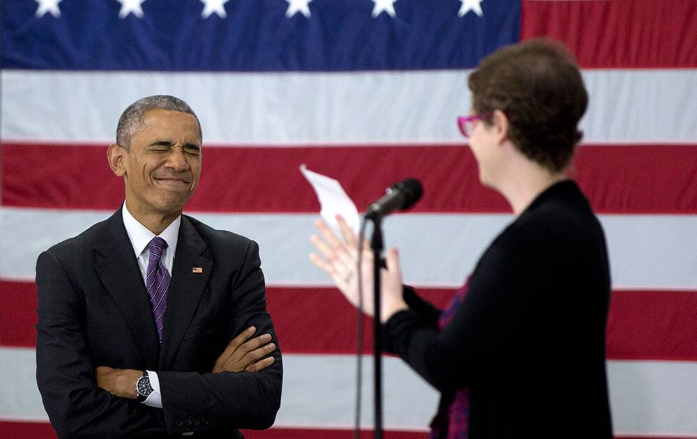 President Barack Obama reacts as he is acknowledged by Kelly Bryant on stage at Taylor Stratton Elementary School in Nashville, Tenn.