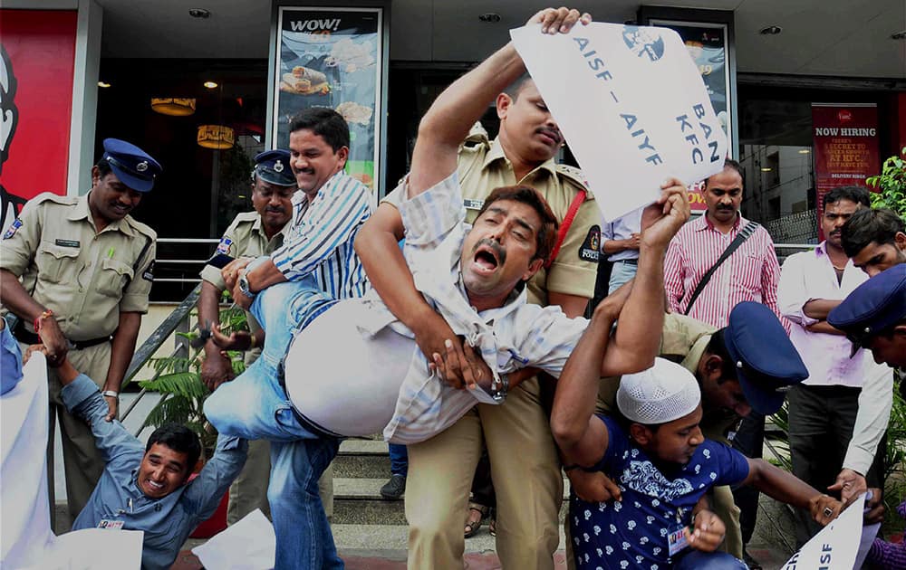 Police arrest All India Youth Federation (AIYF) activists holding a demonstration demanding the ban of KFC which they claim are serving poisonous food in Hyderabad.