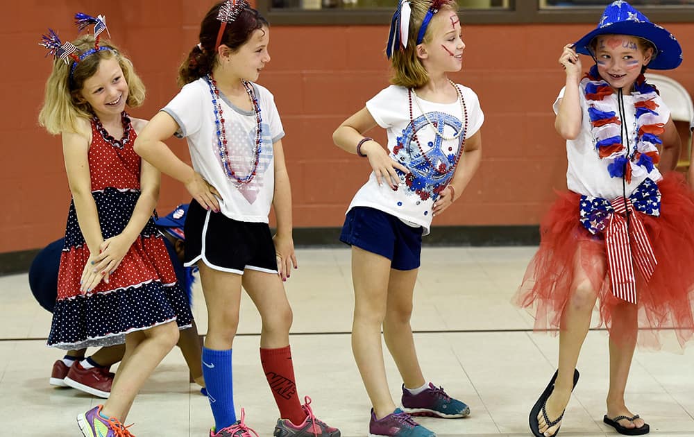 Deaconess summer campers, Emma Griffin, Isabelle Bohleber, Molli Sullivan and Zoey Howell strike their best poses for the judges at the Fourth of July costume contest.