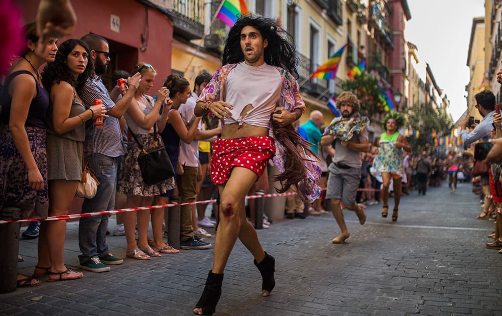 Competitors runs during the Gay Pride High Heels race in Madrid, Spain.