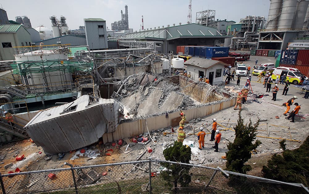 A distorted waste storage facility is seen after an explosion at a chemical plant run by Hanwha Chemical Co. in Ulsan, South Korea.