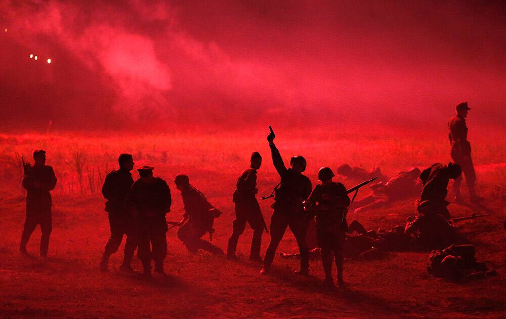 Military enthusiasts take part in a re-enactment of a World War II battle for the liberation of Minsk from the Nazis at the 