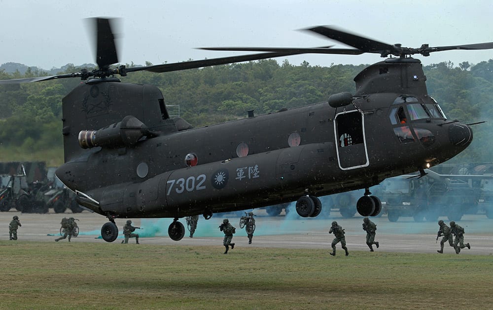 Taiwan's military lands a Chinook transport helicopter during a parade marking the 70th anniversary of the end of WWII, at the military base in Hsinchu, northern Taiwan.