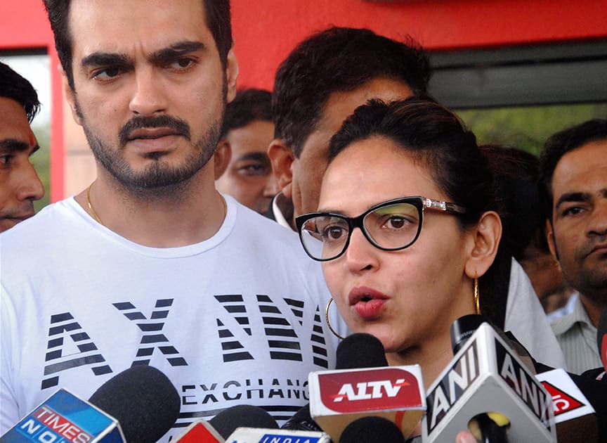 Bollywood actress Esha Deol with her husband Bharat talks to media persons after her mother Hema Malini was discharged on Saturday from a Jaipur hospital to be shifted to Mumbai for further treatment.