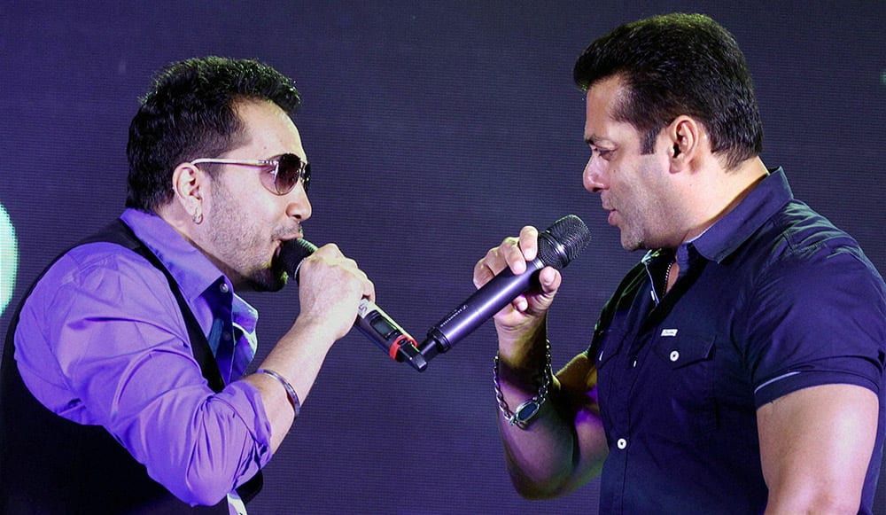 Bollywood actor Salman Khan with singer Mika Singh during the launch of an Eid song from his film Bajrangi Bhaijaan in Mumbai.