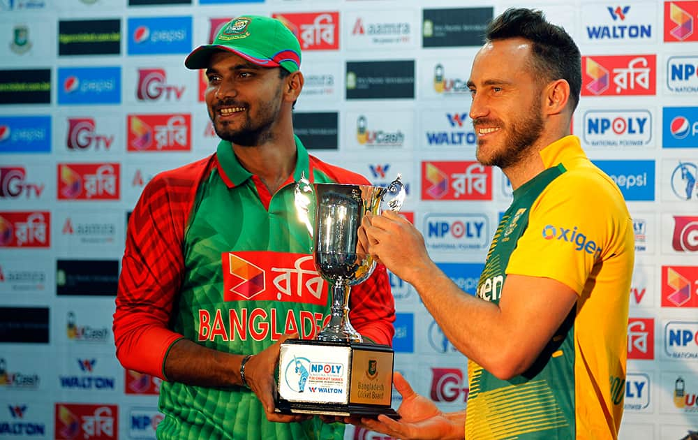 South Africa’s Twenty20 captain Faf du Plessis and Bangladesh’s captain Mashrafe Mortaza pose with the trophy on the eve of the first Twenty20 match of their series in Dhaka, Bangladesh.