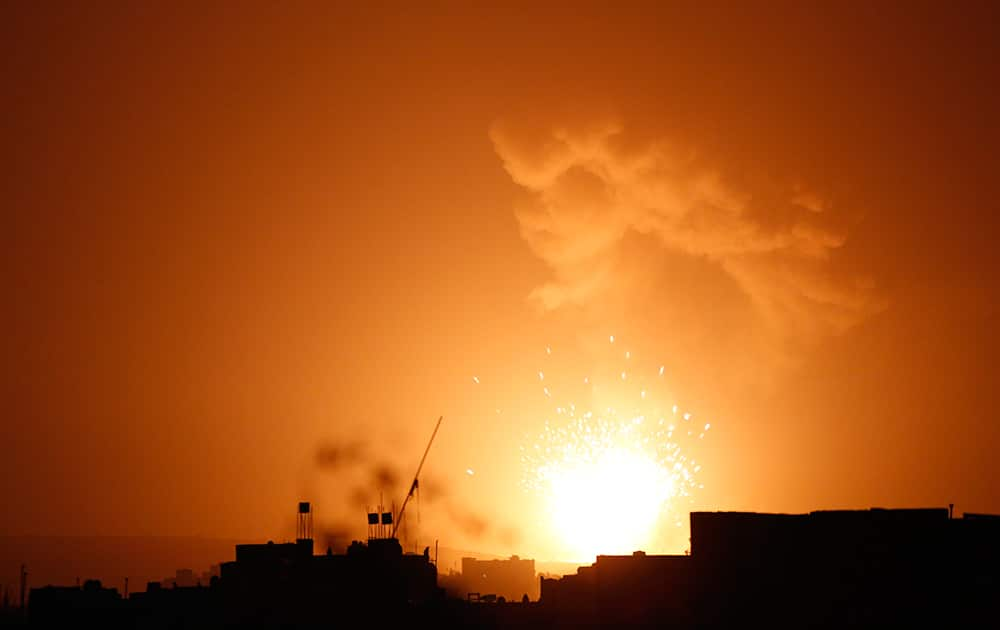 Explosion and smoke rises after a Saudi-led airstrike hit a site believed to be one of the largest weapons depot on the outskirts of Yemen's capital, Sanaa.