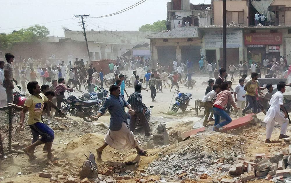 Irate villagers pelt stones at the police after two school children were crushed to death and seven others injured by a speeding truck in Muzaffarnagar.