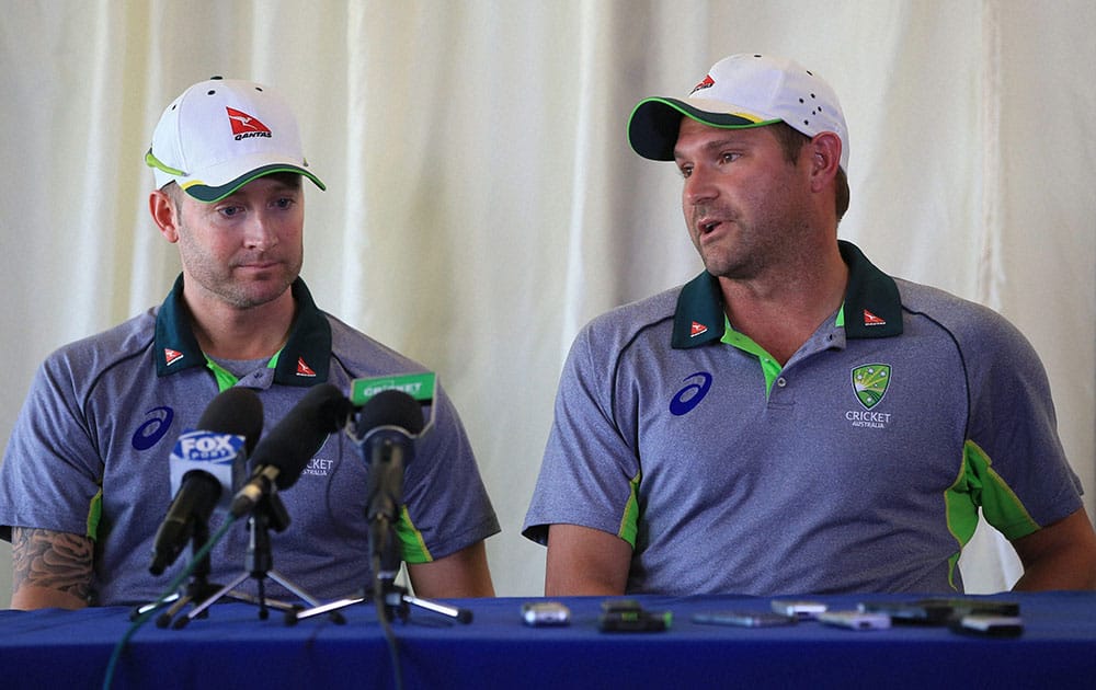 Australias Ryan Harris, who Saturday July 4, 2015, retired from all forms of cricket due to injury, speaks with the media alongside captain Michael Clarke after the tour match at the at the Essex County Ground, Chelmsford, eastern England.