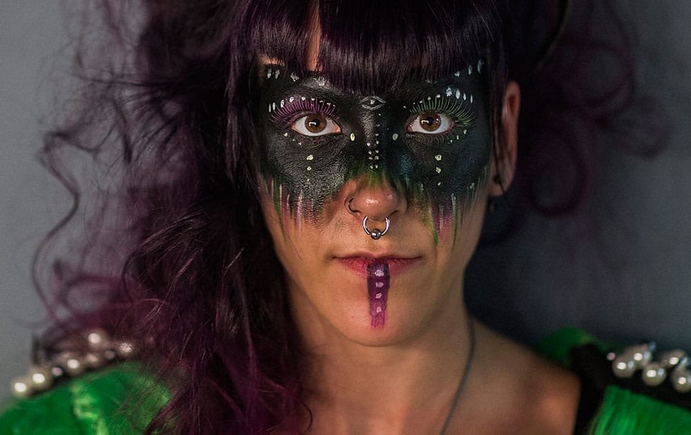 A reveler poses for a picture as she prepares before the Gay Pride parade in Madrid.