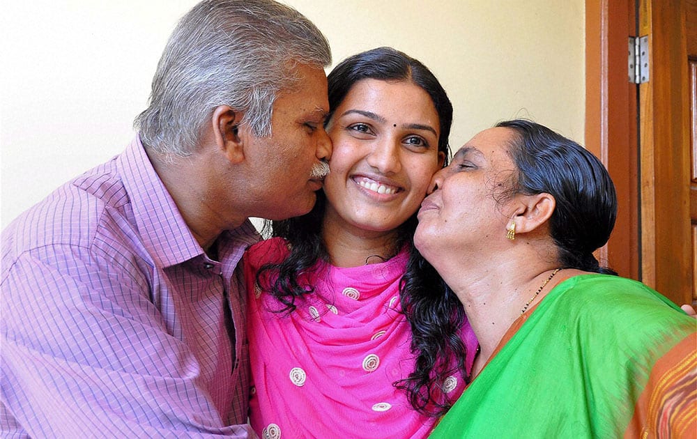 Renu Raj who got the Second rank in the Civil Services Exams 2014, celebrates her succes with the family at the their residence in Thiruvananthapuram.