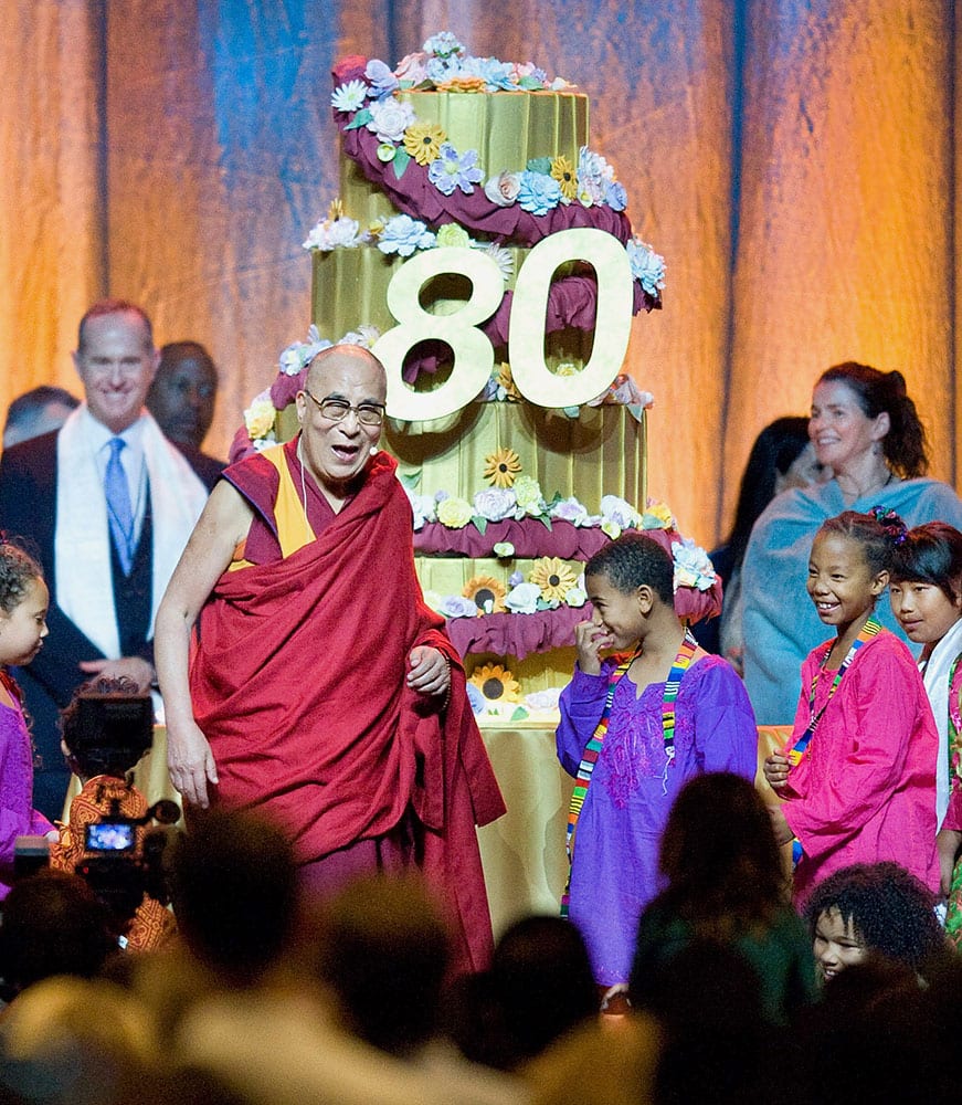 The Dalai Lama appears onstage during a celebration of his 80th birthday at the Global Compassion Summit in Anaheim, Calif.