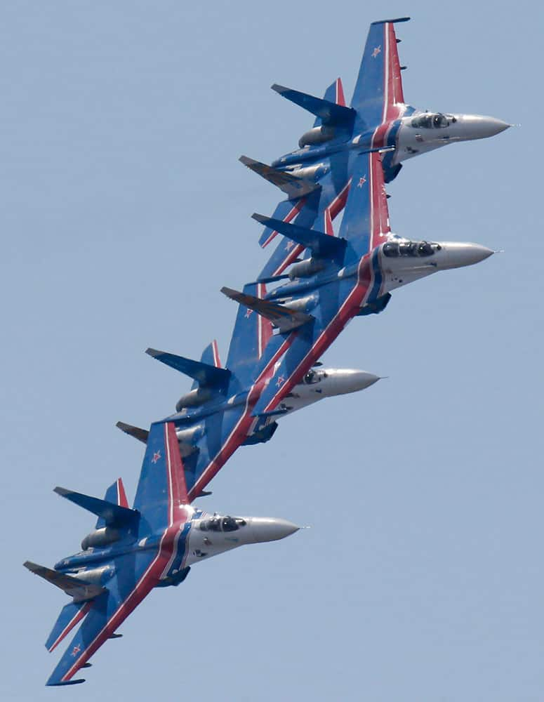 Su-27 jets of aerobatics team Russkiye Vityasy, or Russian Knights perform during an air show at the International Maritime Defence show in St.Petersburg, Russia.