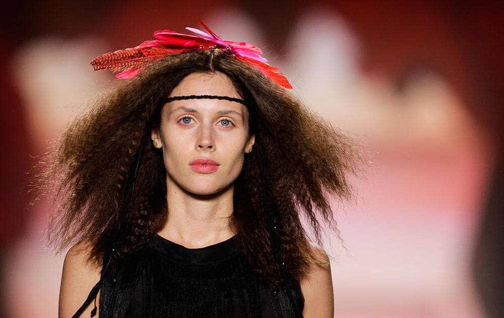 A model wears a creation of the Marc Cain Spring/Summer 2015 collection during the Mercedes-Benz Fashion Week in Berlin.