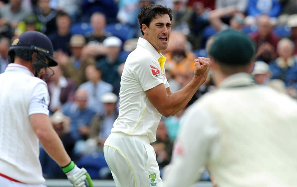 Australia’s Mitchell Starc celebrates after getting England's Ian Bell LBW for one run during day one of the first Ashes Test cricket match, in Cardiff, Wales.