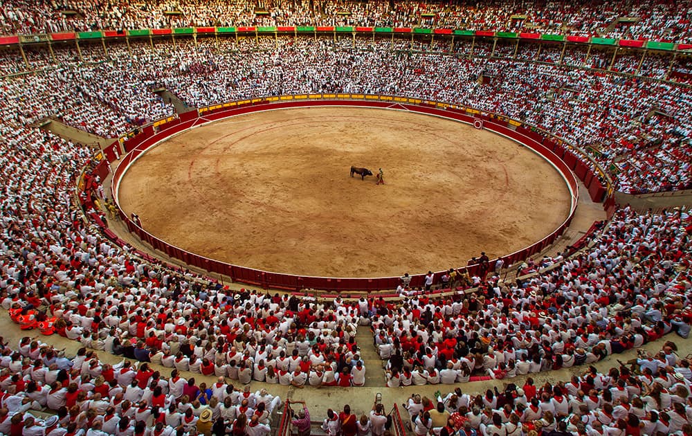 Jimenez Fortes performs with a bull during a bullfight at the San Fermin festival in Pamplona, Spain.