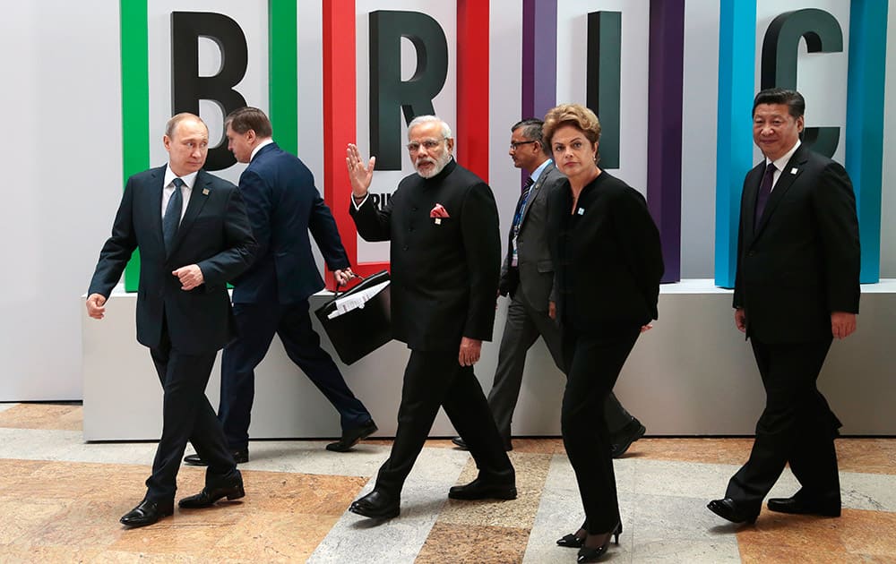 Russian President Vladimir Putin, Indian Prime Minister Narendra Modi, Brazilian President Dilma Rousseff, Chinese President Xi Jinping walk for a plenary session during the summit in Ufa, Russia.