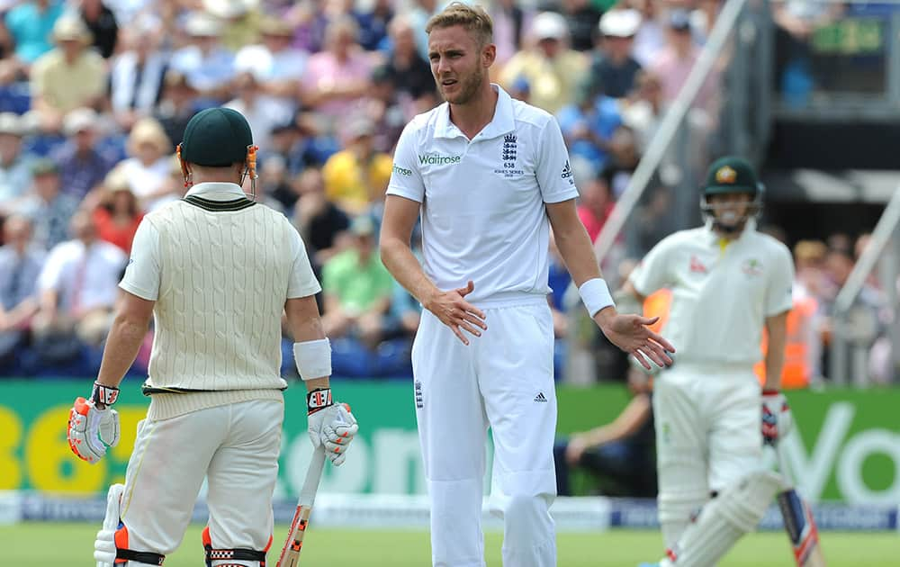 England’s Stuart Broad reacts after an unsuccessful appeal for Australia's David Warner, LBW during day two of the first Ashes Test cricket match, in Cardiff, Wales.