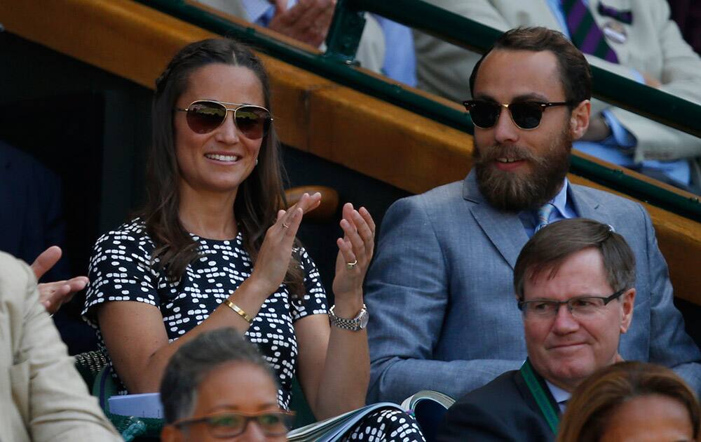 Pippa Middleton, the sister of Kate, the Duchess of Cambridge and her brother James Middleton watch on Centre Court, during the women's semifinal match between Garbine Muguruza of Spain and Agnieszka Radwanska of Poland, at the All England Lawn Tennis Championships in Wimbledon, London.