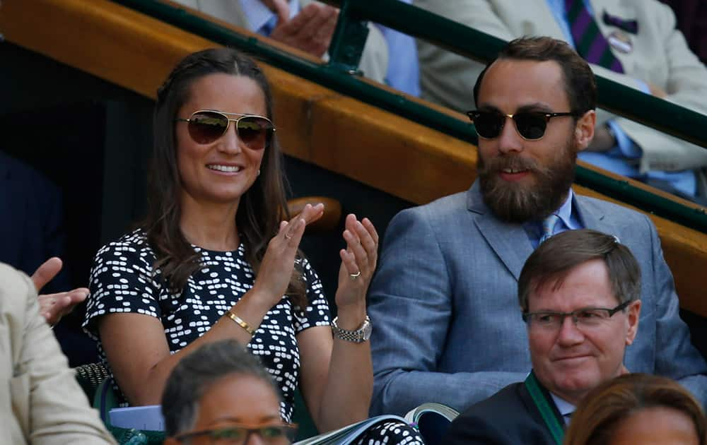 Pippa Middleton, the sister of Kate, the Duchess of Cambridge and her brother James Middleton watch on Centre Court, during the women's semifinal match between Garbine Muguruza of Spain and Agnieszka Radwanska of Poland, at the All England Lawn Tennis Championships in Wimbledon, London.