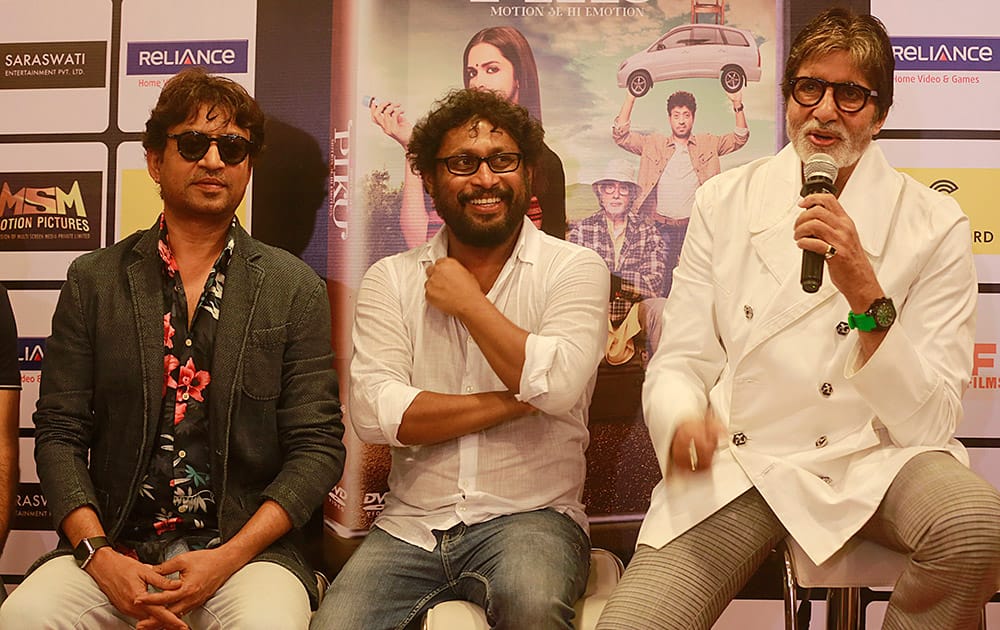 Irrfan Khan and the film director Shoojit Sircar, look on as Bollywood superstar Amitabh Bachchan speaks during the DVD launch of the film ‘Piku’ in Mumbai.