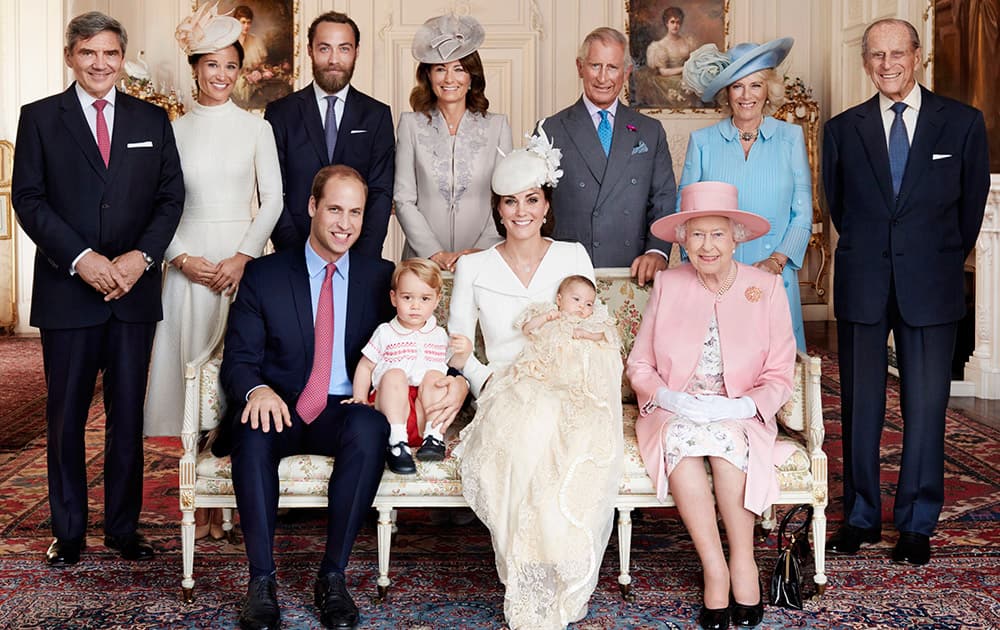 This is a handout image released by Kensington Palace of Britain's Prince William, Kate Duchess of Cambridge with their children, Prince George and Princess Charlotte, at Sandringham House England after the christening.
