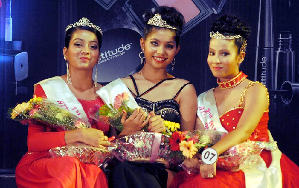 Winner Archna Sharma (middle), 1st runner up Riha Chakraborty (Right) and 2nd runner up Dhrupadi Das (Left) posing for a photographer after winning the Attitude Fashion Show 2015 at Shankardev Kalakhetra in Guwahati.