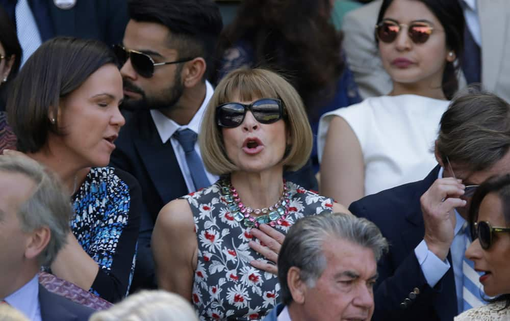 Vogue editor Anna Wintour, Virat Kohli and Anushka Sharma sit in the Royal Box, on Centre Court, ahead of the men's singles semifinal matches, at the All England Lawn Tennis Championships in Wimbledon, London.