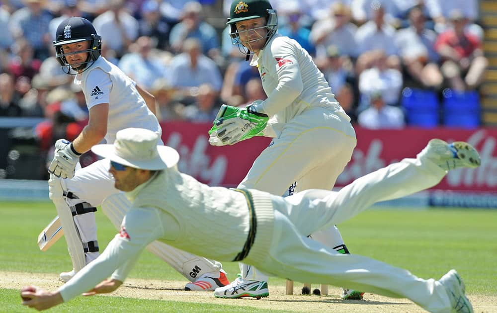 England’s Adam Lyth is caught by Michael Clarke for 37 runs off the bowling Australia’s Nathan Lyon during day three of the first Ashes Test cricket match, in Cardiff, Wales.