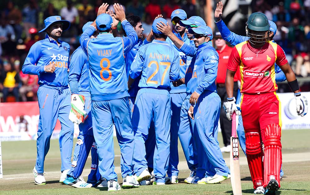 Players celebrate after dismissing Zimbabwean batsman Chamunorwa Chibhabha, during the One Day International against Zimbabwe in Harare, Zimbabwe.