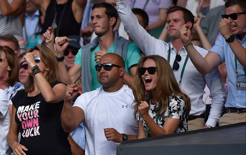 Kim, wife of Andy Murray of Britain celebrates after Murray wins a game against Roger Federer of Switzerland during the men's singles semifinal match at the All England Lawn Tennis Championships in Wimbledon, London.