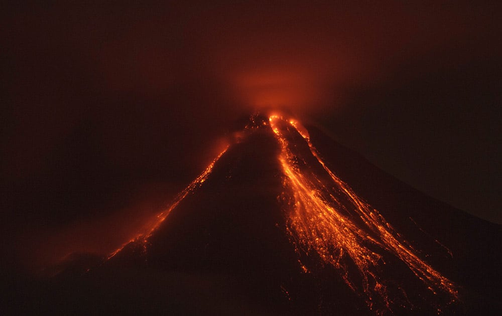 Lava flows down the banks of the Colima Volcano, also known as the Volcano of Fire, near the town of Comala, Mexico.