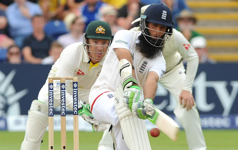 England’s Moeen Ali plays a shot during day three of the first Ashes Test cricket match, in Cardiff, Wales.