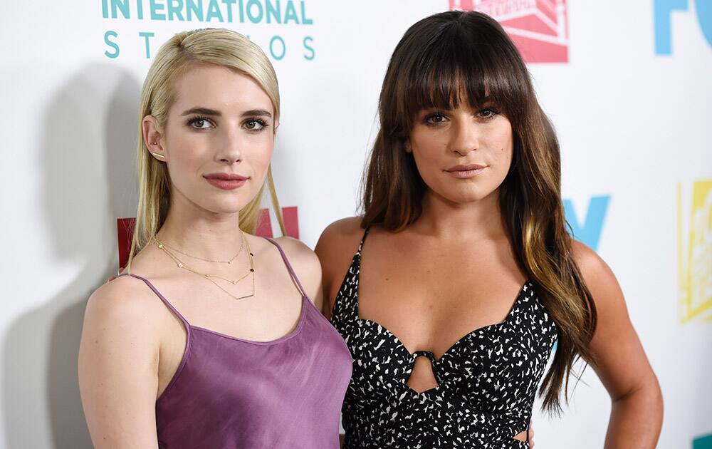 Emma Roberts and Lea Michele, cast members on the television series 'Scream Queens,' pose together at the Fox/FX/10th Century Fox TV/Fox International Channels Comic-Con Party, in San Diego, Calif. 